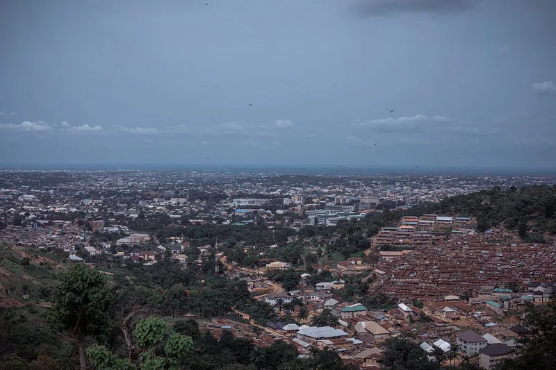 View over Enugu city from the hills, with dense rooftops and the plain beyond
