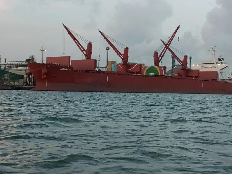 A red bulk carrier moored at Apapa port in Lagos, seen from the water