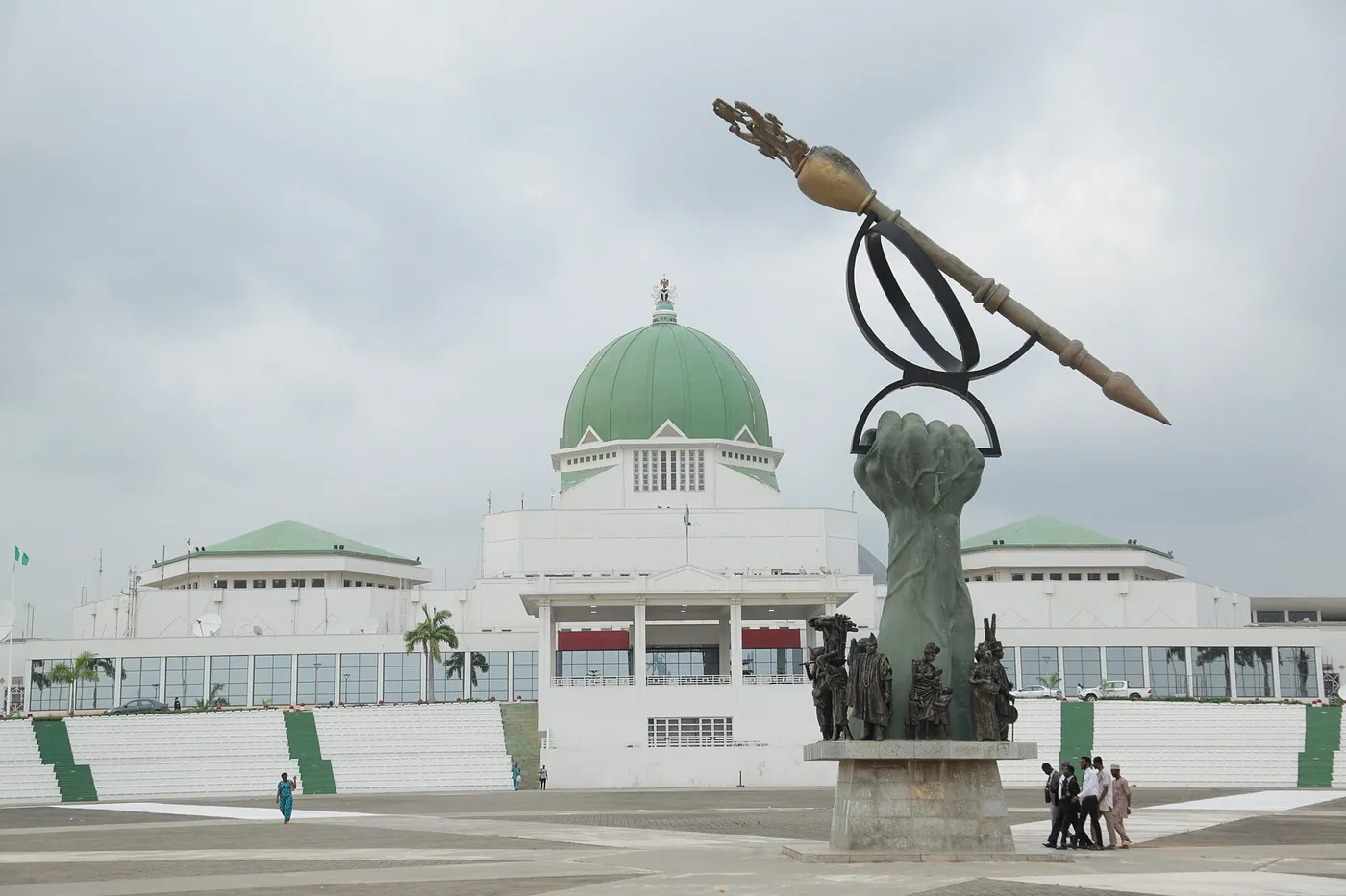 The National Assembly building in Abuja with the mace monument in the foreground